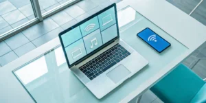 Laptop and smartphone displaying a radio player interface to find a stream URL.